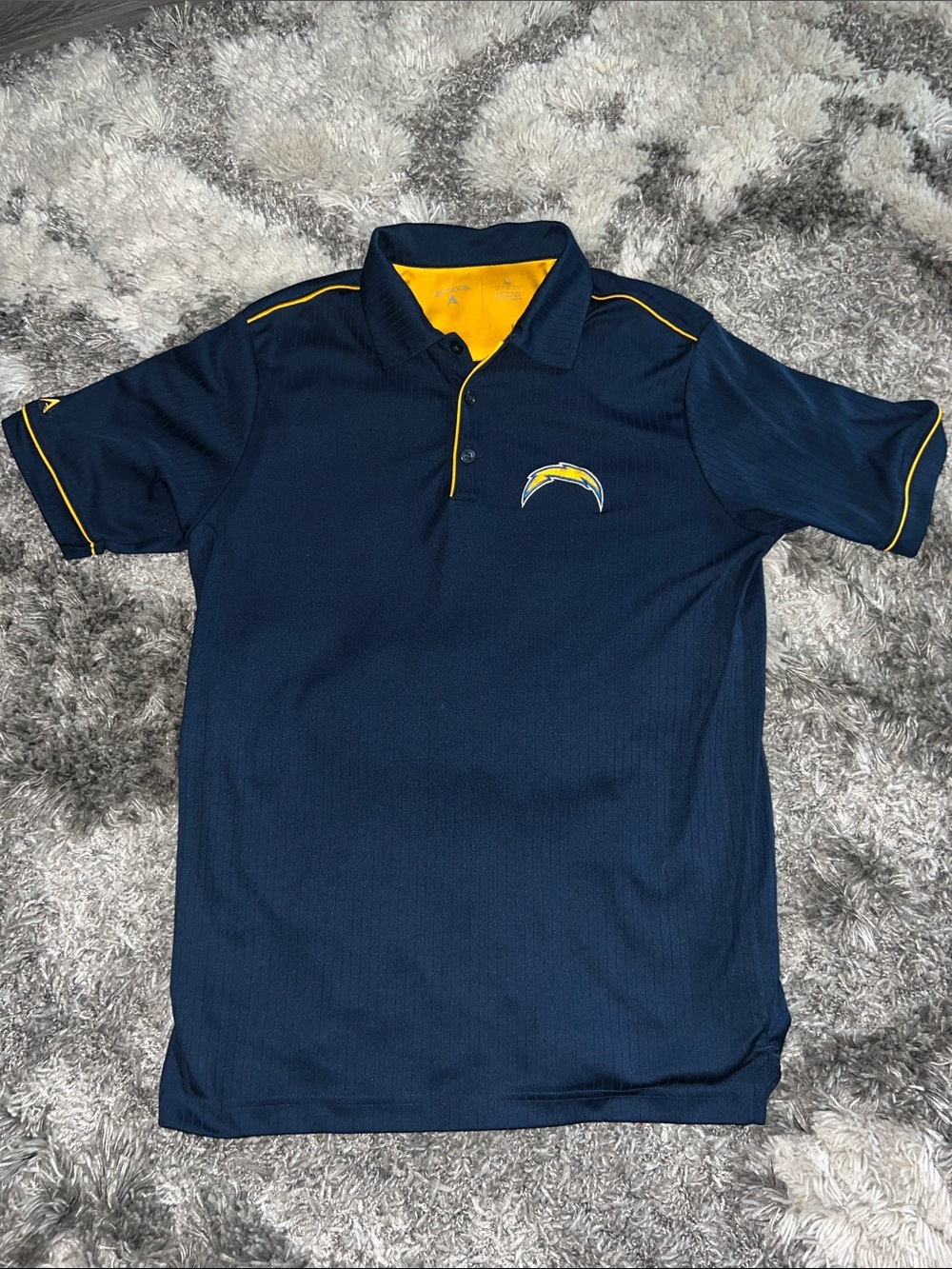 Antigua Men's Polo Los Angelas Chargers in Golden Yellow with Navy Accents.